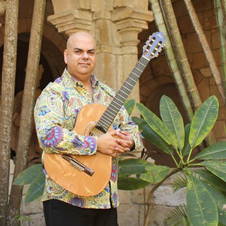 Arturo Romay with guitar